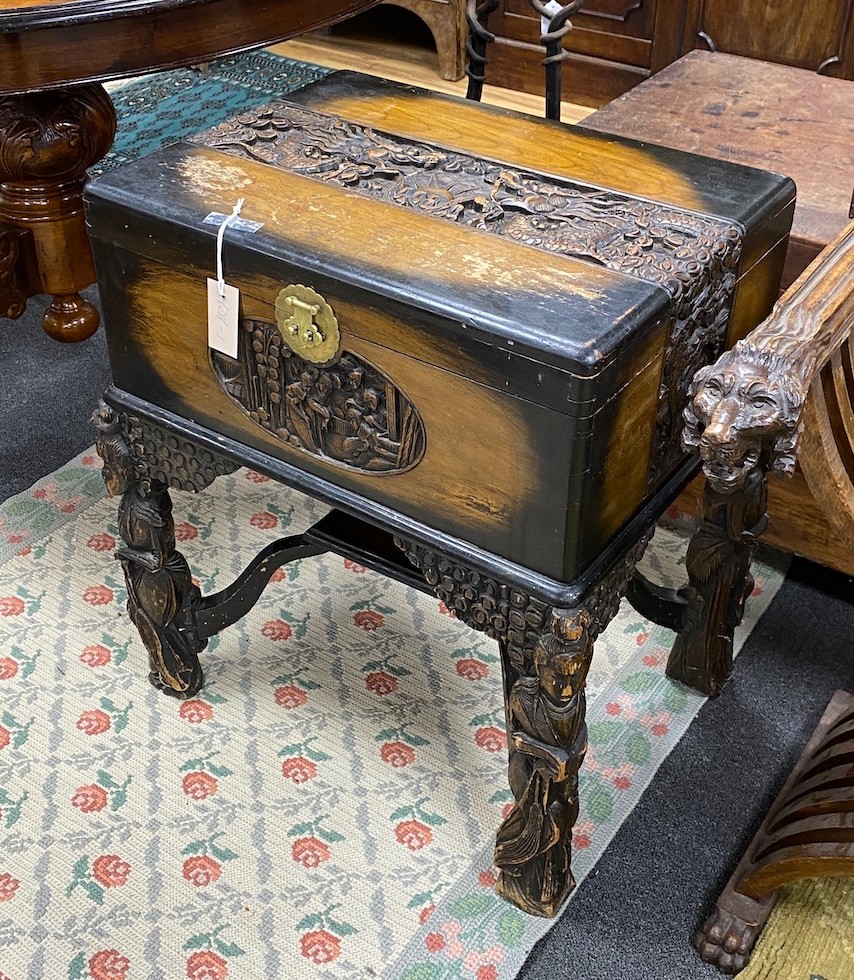 A Chinese carved camphorwood work box, width 60cm, depth 46cm, height 67cm